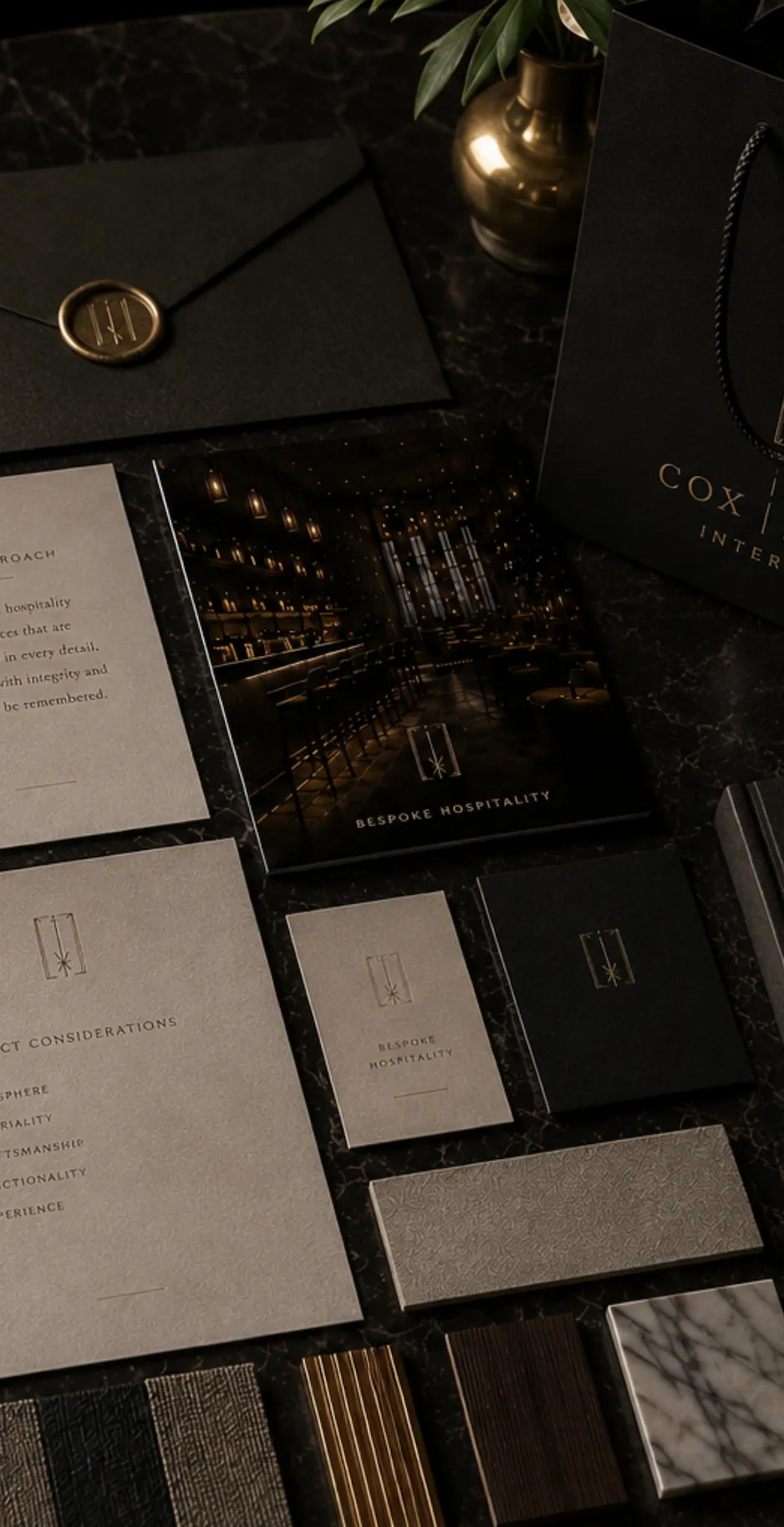 Cox Jones Interiors brand identity collateral — gold-foiled business cards, wax-sealed envelopes and a brochure featuring a bespoke luxury bar interior